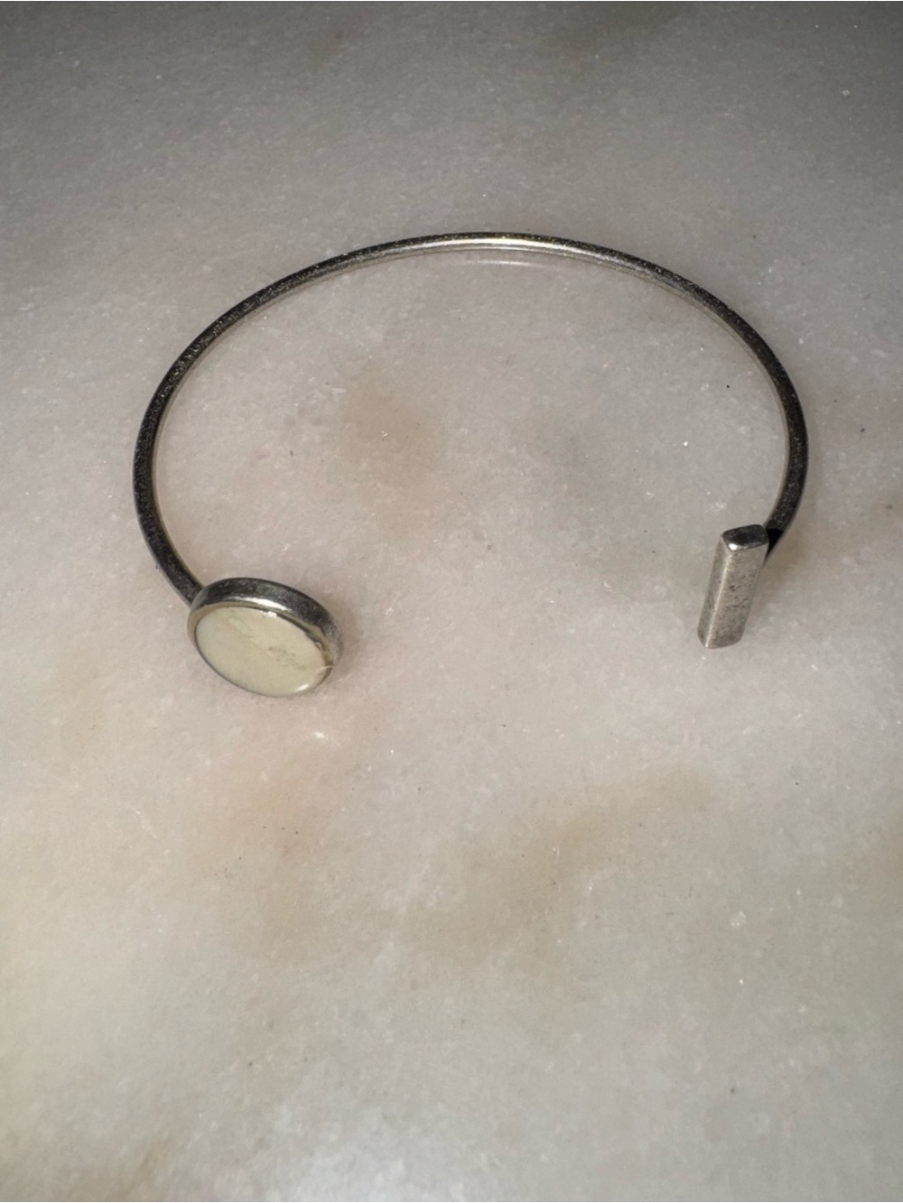 Open cuff bracelet with white stone
